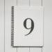Black and white image of a notebook with the number 9